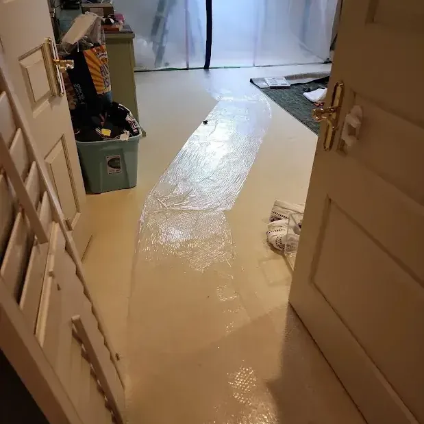 Water covering a floor through open interior doorways